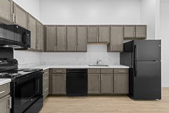 Kitchen with black appliances and brown cabinets